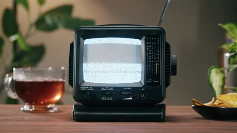 Small old television with grey interference screen on home background. Close-up 库存影片 168618739