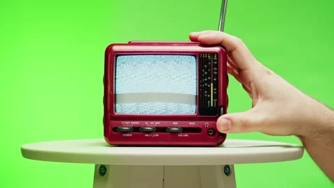 Small old television with grey interference screen on chroma green background Stock Footage 169115010
