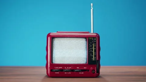 Small old television with grey interference screen on blue background. Close-up Stock Footage 169115303