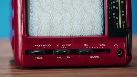 Small old television with grey interference screen on blue background. Close-up Stock Footage 169115427