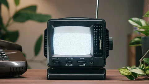 Small old television with grey interference screen on home background. Close-up Stock Footage 169116418
