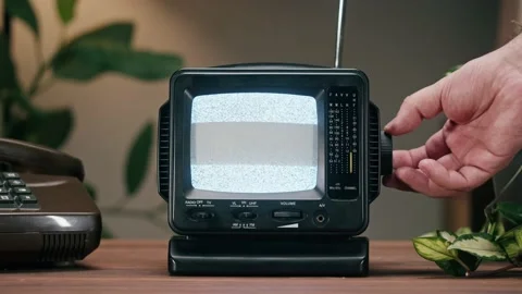 Small old television with grey interference screen on home background. Close-up Stock Footage 182002922