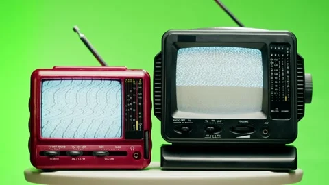 Small old televisions with grey interference screen on chroma green background Stock Footage 168989725