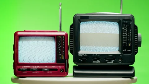 Small old televisions with grey interference screen on chroma green background Stock Footage 168991971