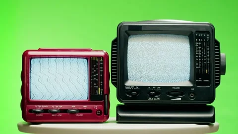 Small old televisions with grey interference screen on chroma green background Stock Footage 169195713