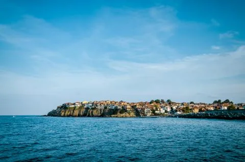 Small old town on the cape between sea and sky Stock Photos