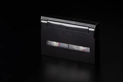 Small old video cassette on the table. Stock Photos