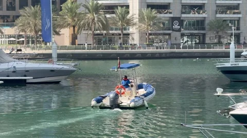 A small one along the Dubai Marina Canal. Dubai UAE 4 September 2026. Stock Footage 345235787