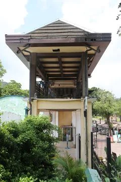 A small open-air building with an elevated balcony at the entrance of a pet.. Stock Photos