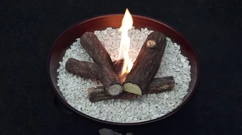 Small open fire pit with ceramic logs Stock Footage 58821097