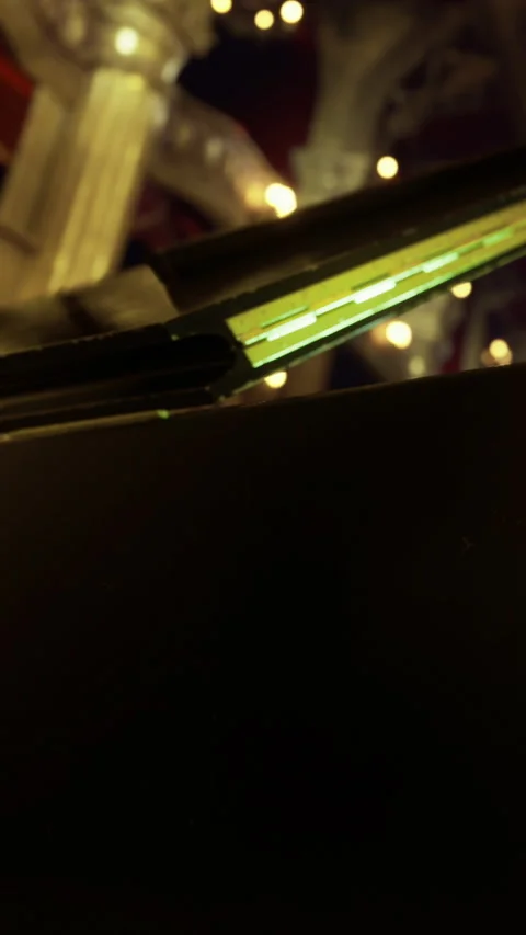 A small opening reveals a bright light in a dark venue Stock Footage 332215206