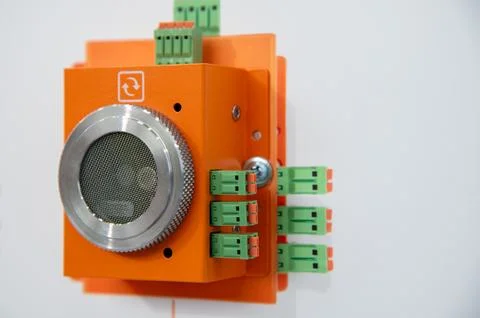 A small orange box with a silver mesh on the front Stock Photos