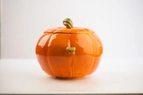 Small orange ceramic pumpkin sugar-bowl. For pumpkin porridge Stock Photos