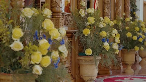 Small orbit of Vibrant Yellow Rose and Blue Delphinium Floral Arrangements Stock Footage 283955070