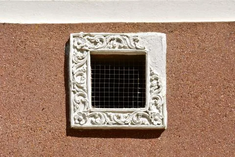 Small ornate ventilation window. Stock Photos