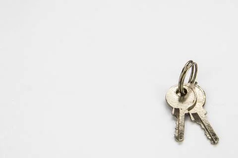 Small pair of keys isolated on white background.  Close up Stock Photos