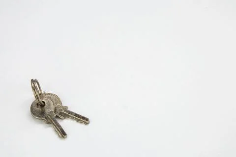 Small pair of keys on a keychain.  Isolated on a white background.  Close up Stock Photos