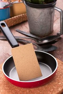 Small pan and blank note Stock Photos
