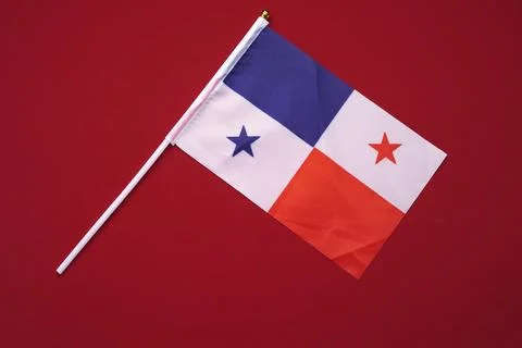 Small Panama flag isolated on a red background. Stock Photos