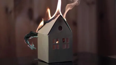 Small paper house completely burns down, burning house, fire, slow motion Stock Footage 243281172