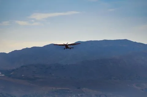 Small parachuting plane o Stock Photos