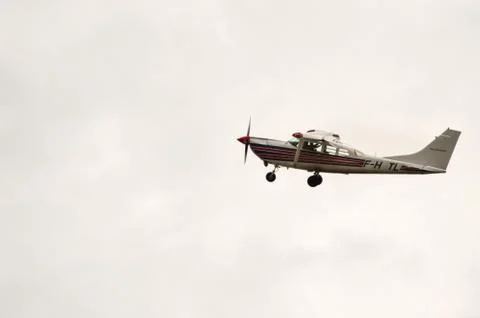 Small parachuting plane Stock Photos