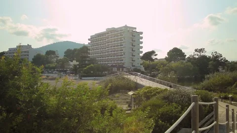 A small park next to the sea and the hotel complex. Mallorca Stock Footage 76033138