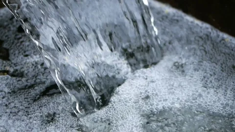 Small park waterfall from an artificial water channel at 50% speed Vídeo Stock 94158801
