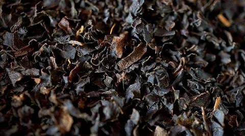 Small particles of dried tea close-up Stock Photos