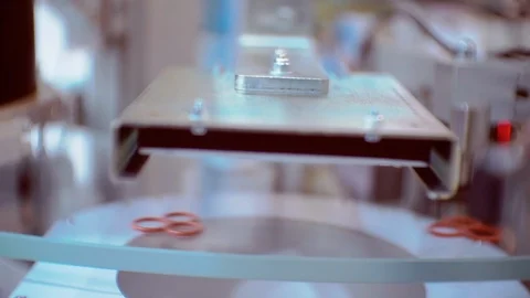 Small parts moving quickly on a transparent circular conveyor Stock Footage 126899367