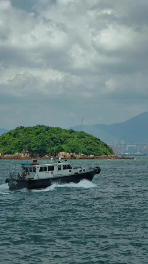 Small Passenger Boat Passing Green Island, Kennedy Town, Hong Kong Stock Footage 345253582