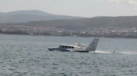 Small passenger hydroplane u-turn on water surface Stock Footage 7135146