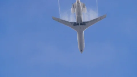 Small passenger jet passes directly over camera in 180fps slow motion, clear day Stock Footage 112954147