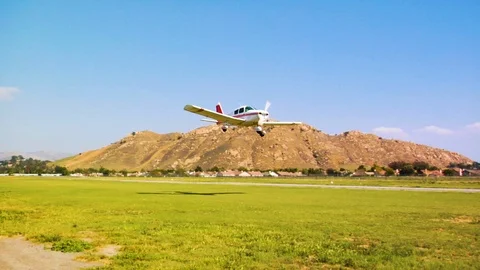 Small Passenger Plane Makes A Low Pass Over A Runway Stock-Footage 90318391