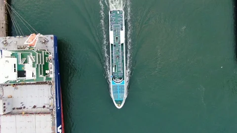 Small passenger ship doing excursion on Rotterdam industrial port area. Stock Footage 119684721