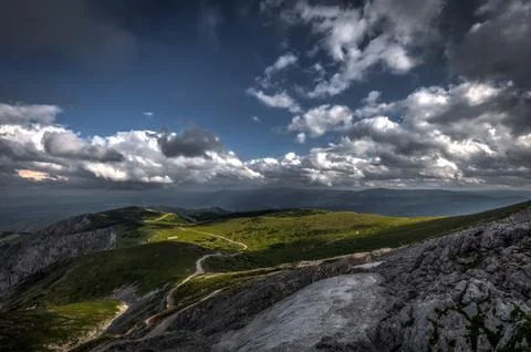 Small patch of snow in the summer in the middle of grassy meadow in rax plateau Foto stock