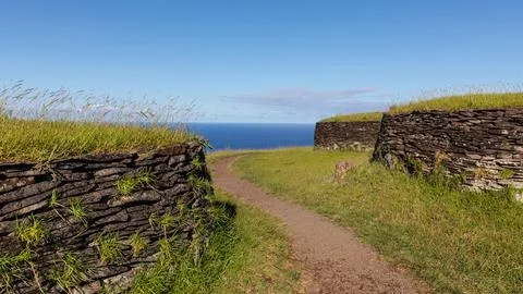 A small path leads through green meadows and past rock tombs in the ruins o.. Stock Photos