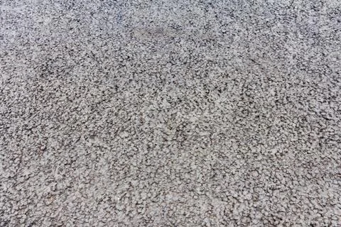 Small pattern of stones and bitumen on the pavement Stock Photos