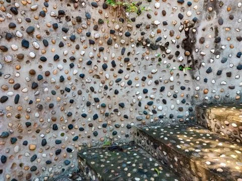 Small pebble patterns on a concrete staircase. Stock Photos