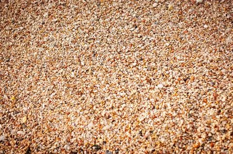 Small pebbles background. warm shades Stock Photos