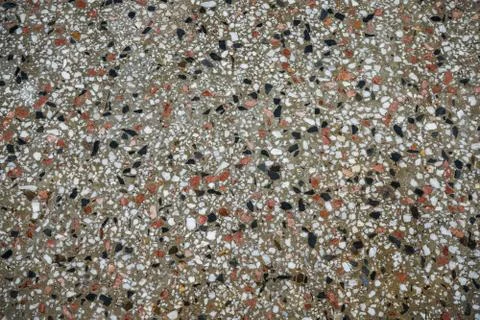 Small pebbles embedded in concrete can be very decorative for the exterior or Stock Photos