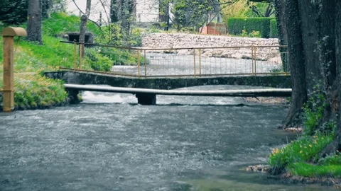 A Small Pedestrian Bridge over the River 스톡 동영상 94903699