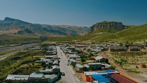 Small Peruvian Town fly-over to Cliff face in the Colca Canyon Stock Footage 113093054