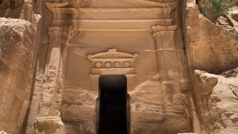 Small Petra of Jordan. The Monastery building behind twigs in the historic and Stock Footage 237809042