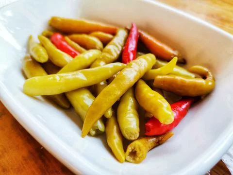 Small pickled peppers. Stock Photos