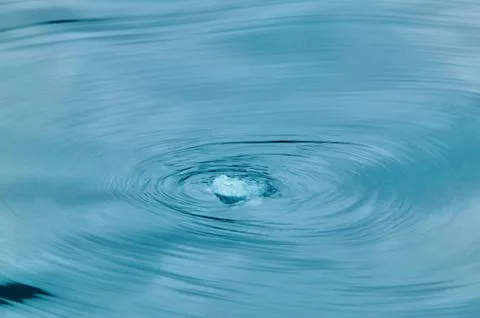 Small piece of ice causing a vortex current Stock Photos