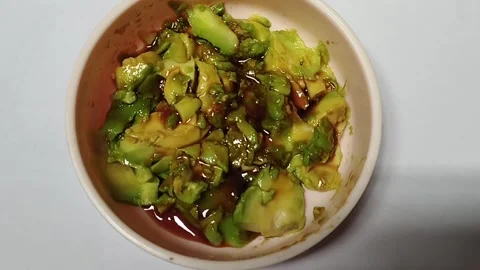 Small pieces of avocado with date syrup very tasty Stock Footage 224822395