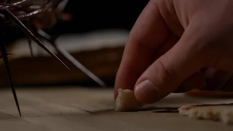 Small pieces of bread being placed on table Stock-Footage 128587558