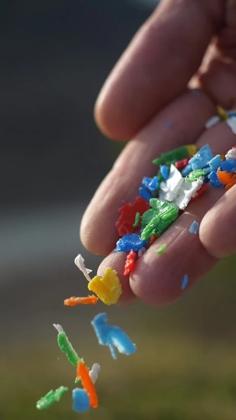 Small pieces of plastic close up vertical video. primary and secondary Stock Footage 269205408