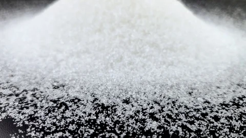 Small pieces of sugar are poured on the sugar mountain. The concept of sweet too Stock Footage 125031446